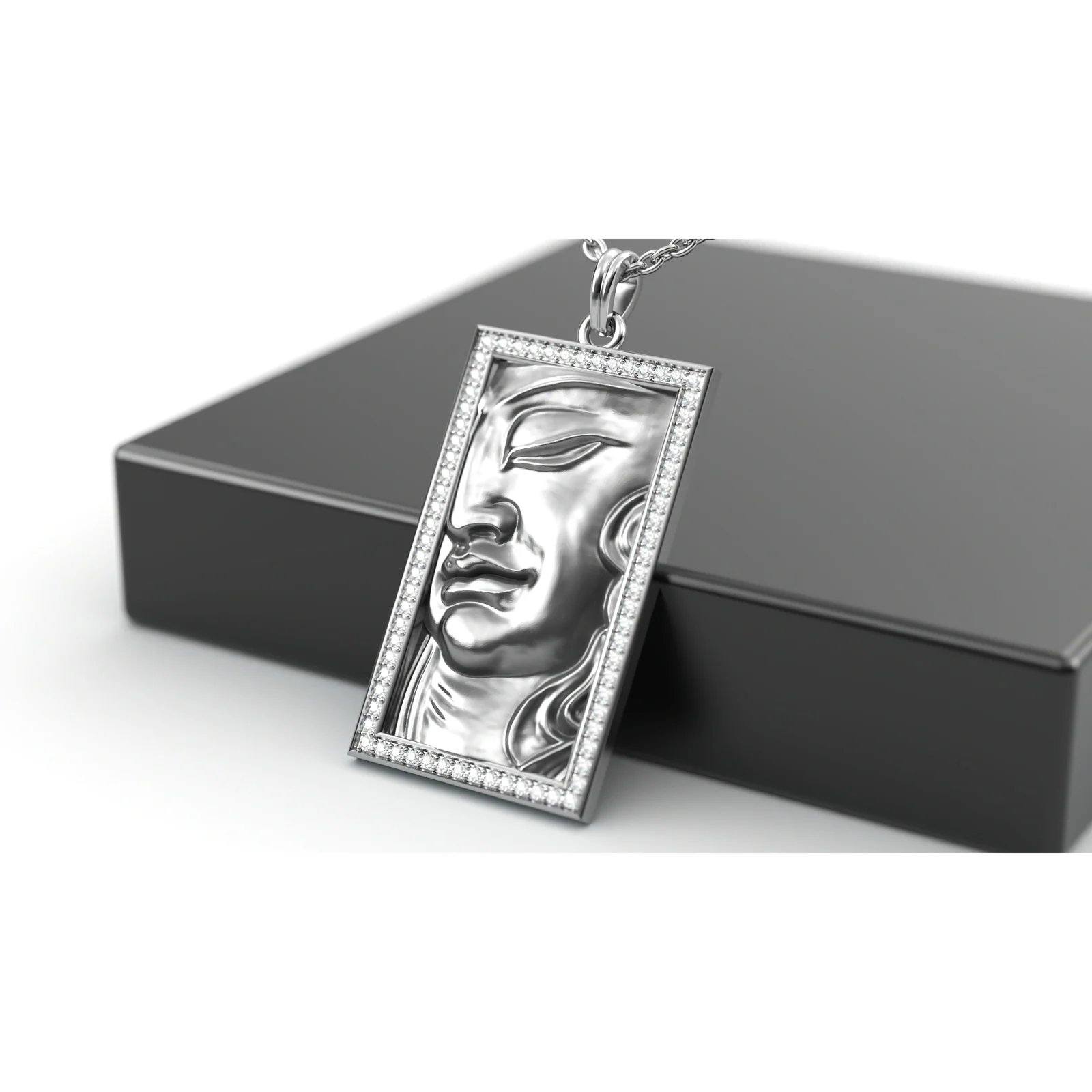 The Athena Tablet pendant photographed on its presentation box